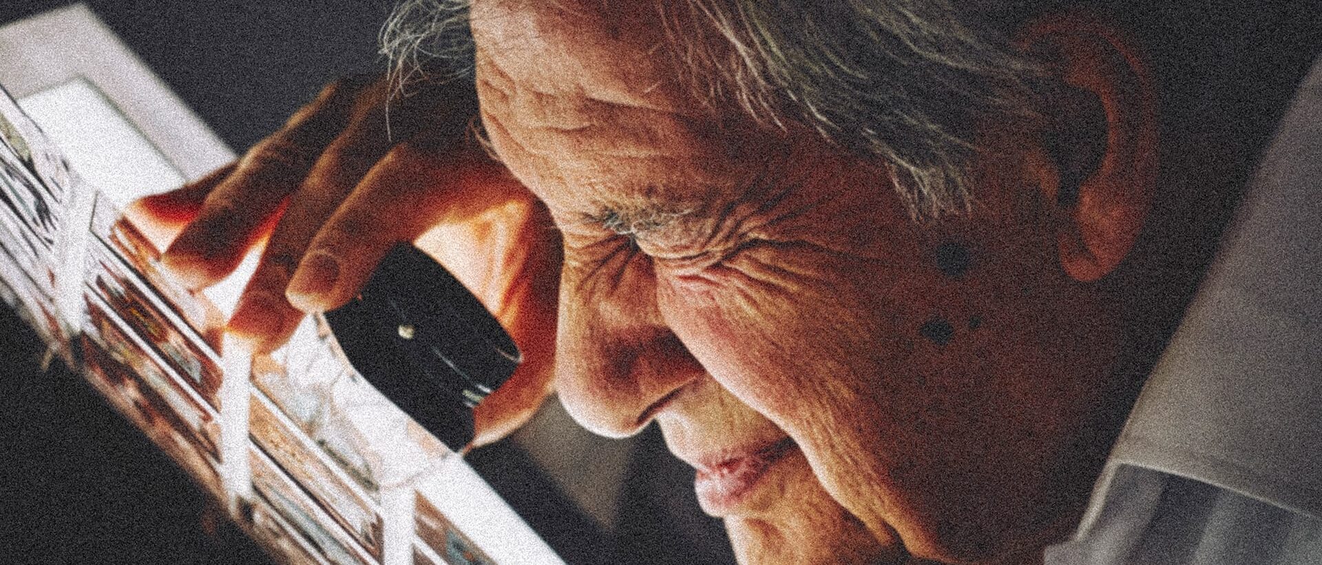 A man checking the photo negatives.